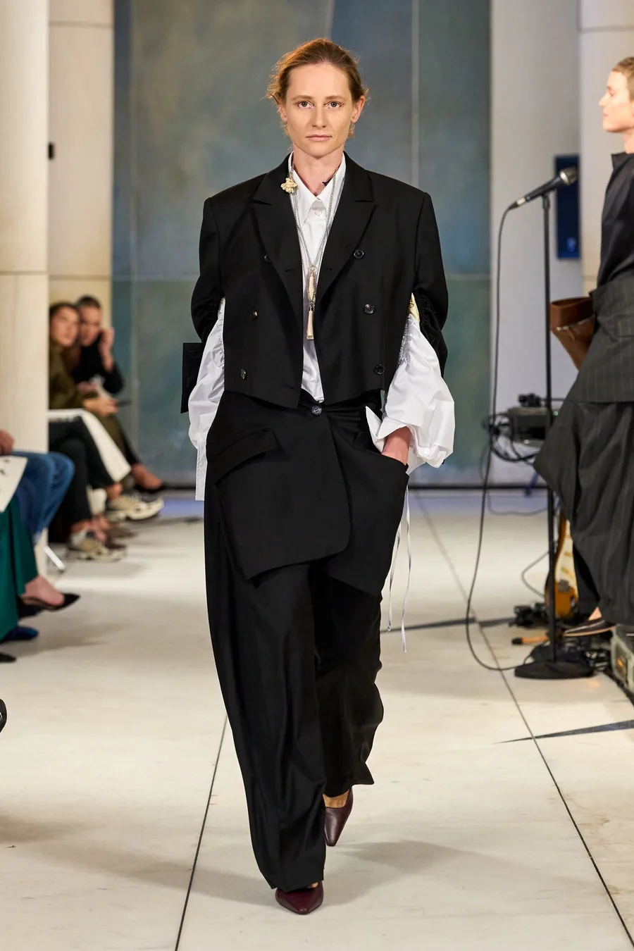 SHOWstudio, Litkovska S/S 27 STRICHA: model in a black suit and white shirt on the runway