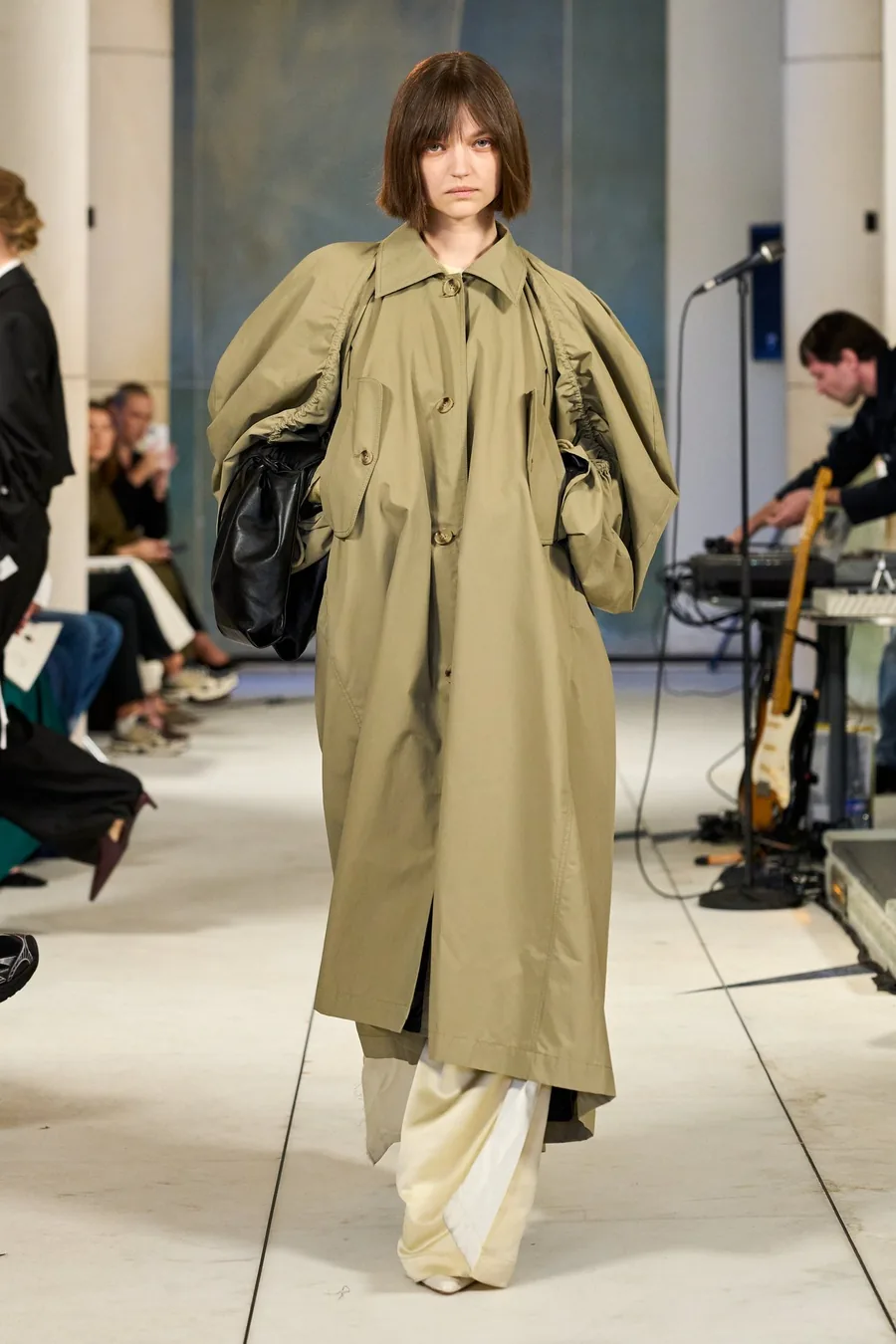 SHOWstudio, Litkovska S/S 27 STRICHA: model in a long khaki coat with voluminous sleeves